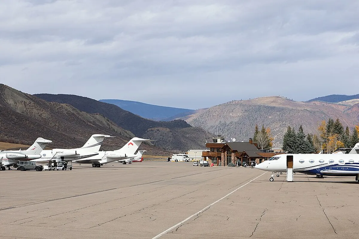 Private jets parked on the apron at Aspen/Pitkin County Airport in autumn
