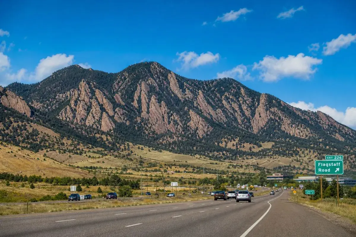 Flatirons rock formations along US-36 approaching Boulder