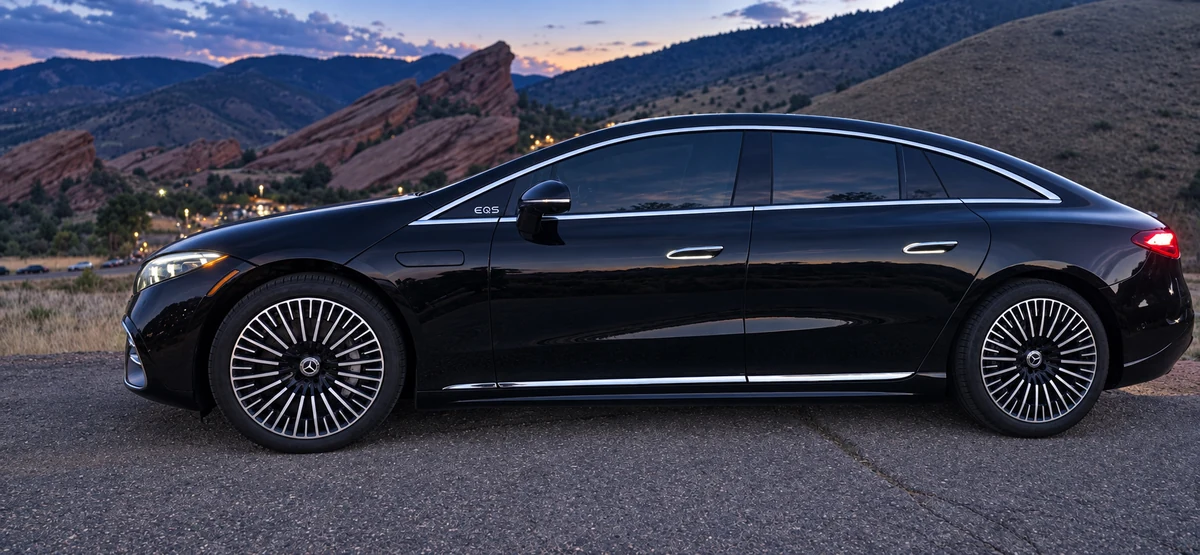 Arion Luxury Sedan — 2023 Mercedes-Benz EQS 450 all-electric sedan with the Red Rocks foothills behind it