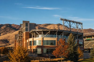 Canvas Stadium in Fort Collins, Colorado on an autumn afternoon with the foothills behind it