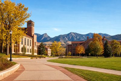 University campus quad with autumn trees and the Front Range behind, Fort Collins Colorado