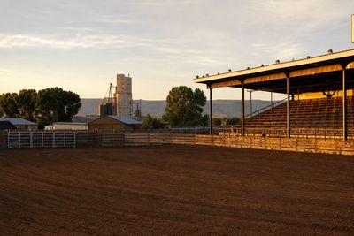 Rodeo arena and grandstand on the Colorado plains at golden hour near Greeley