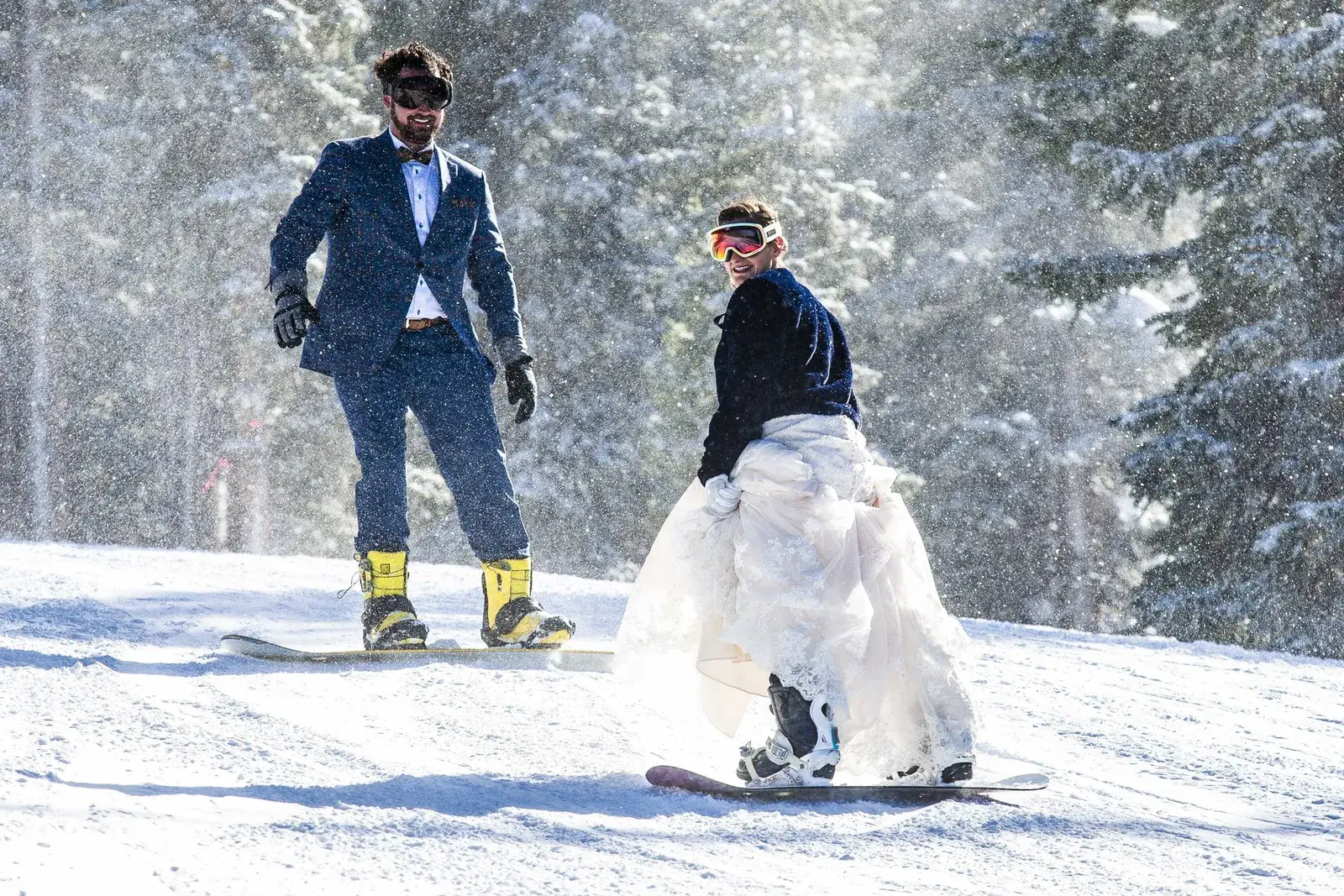 Bride and groom snowboarding at Mary Jane, Winter Park Resort